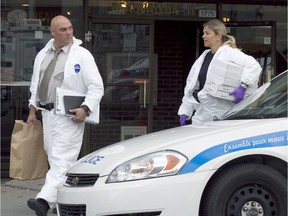 Police investigate the scene of Rakib Ullah Mohammed's death on Côte-des-Neiges Rd. in August 2011.