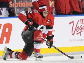 Dion Phaneuf stretches in the warm up before the Ottawa Senators take on the Montreal Canadiens in the 2017 Scotiabank NHL 100 Classic outdoor hockey game at TD Place in Ottawa. (Wayne Cuddington/ Postmedia )