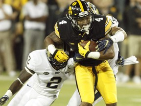Wide receiver Tevaun Smith of the Iowa Hawkeyes is brought down against the Pittsburgh Panthers on Sept. 19, 2015