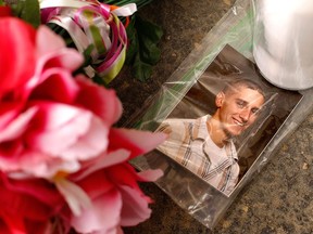 A photo of victim William Porterfield sits at a memorial near Ed's Car Wash after a deadly shooting Monday, Jan. 29, 2018, in Saltlick Township, Pa. (AP Photo/Gene J. Puskar)