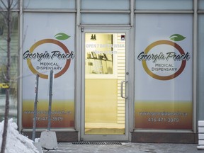 Police executed a search warrant at the Georgia Peach Dispensary at 550 Queens Quay West. in Toronto, Ont. on Wednesday, Jan. 3, 2018. (ERNEST DOROSZUK/TORONTO SUN)