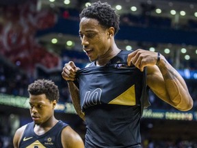Toronto Raptors DeMar DeRozan (front) and Kyle Lowry react to a loss against the Utah Jazz at the Air Canada Centre in Toronto, Ont. on Friday January 26, 2018.