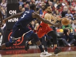 Raptors' Fred VanVleet breaks past Minnesota Timberwolves' Gorgui Dieng during NBA action at the ACC last night. (Jack Boland/Toronto Sun)