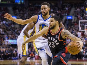 Raptors Fred VanVleet drives past Golden State Warriors Stephen Curry at the Air Canada Centre in Toronto, Ont. on Saturday January 13, 2018. Ernest Doroszuk/Toronto Sun/Postmedia Network