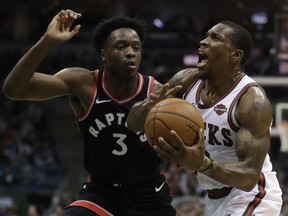 Bucks’ Eric Bledsoe (right)tries to drive on the Raptors’ OG Anunoby. As a rookie, Anunoby doesn’t back down from anyone. (AP Photo/Morry