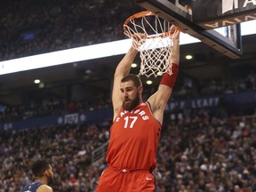 Toronto Raptors Jonas Valanciunas slams one down during the first half against the Timberwolves in Toronto on Tuesday January 30, 2018. Jack Boland/Toronto Sun