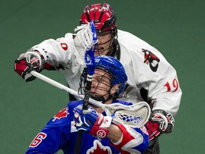 Kieran McArdle of the Toronto Rock (front) pivots around Justin Salt of the Vancouver Stealth on his way to score in a regular season NLL lacrosse game in Langley, B.C., on January 6, 2018. (GERRY KAHRMANN/ Postmedia Network)