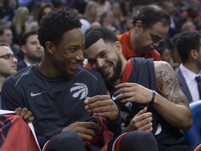 Toronto Raptors DeMar Derozan and  Fred VanVleet (23)  yuk it up near the end of the game, as the Raptors beat the Cavaliers 133-99, in Toronto, Ont. on January 11, 2018. Stan Behal/Toronto Sun/Postmedia Network