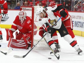 Ottawa Senators right wing Bobby Ryan (9) loses the puck as Detroit Red Wings defenseman Danny DeKeyser defends during the first period of an NHL hockey game Wednesday, Jan. 3, 2018, in Detroit.