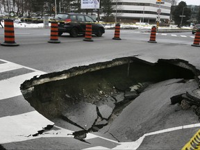 A sinkhole causes traffic delays in the southbound lanes of Yonge St. at William Carson Crescent on Wednesday January 10, 2018. Veronica Henri/Toronto Sun/Postmedia Network