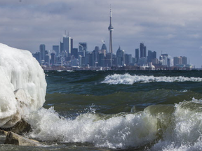 Sun file photo of the Toronto skyline as waves, snow and ice are seen from the waterfront in Etobicoke.