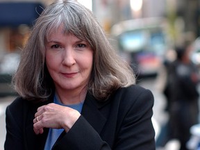 In this Oct. 15, 2002 file photo, mystery writer Sue Grafton poses for a portrait in New York. Grafton has died in Santa Barbara, Calif., at the age of 77. Her daughter, Jamie Clark says her mother passed away Thursday night, Dec. 28, 2017, after a two-year battle with cancer and was surrounded by family. (AP Photo/Gino Domenico, file)