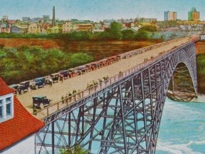 In this undated souvenir postcard, the ill-fated Upper Steel Arch Bridge is jammed with automobiles, most them crossing from Niagara Falls, N.Y. into Canada. Back then, it was necessary for American visitors to obtain an entry permit not for themselves, but for the vehicle. Though we don’t know exactly when the photo from which this hand-coloured card was prepared, we do know that based on the age of most of the autos in the view, the bridge must have been approaching its 40th anniversary, an event that would occur in 1938. But the bridge was already showing its age. Having been built to specifications that pre-dated motorized traffic and heavy electric streetcars, it wasn’t surprising to learn that many engineers were recommending that a new, sturdier structure be built, and sooner than later. In fact, on several occasions, winter ice choking the flow of the Niagara River had impacted the lower girders supporting the arch, resulting in important repairs having to be made so the structure wouldn’t suddenly collapse. Unfortunately, as 1937 came to an end, the weather gods were bringing together a trio of conditions that would eliminate any chance of a 40th anniversary. See also torontosun.com/news/local-news/the-way-we-were for additional photos. (Niagara Falls, Ontario Public Library)