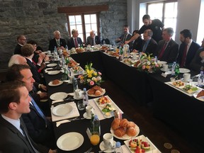 A group of Canadian and American politicians gather for a breakfast conversation about NAFTA during the current round of talks in Montreal, on Saturday, Jan. 27, 2018.