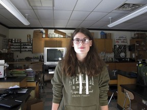 In this Dec. 11, 2017 photo, Kimberly Taylor, one of three high school students remaining at the Rochester School, stands in an empty science classroom at the school in Rochester, Vt. (AP Photo/Lisa Rathke)