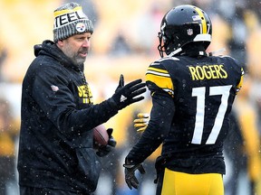 Pittsburgh Steelers offensive coordinator Todd Haley talks to Eli Rogers during warmups at Heinz Field on December 31, 2017 in Pittsburgh. (Joe Sargent/Getty Images)