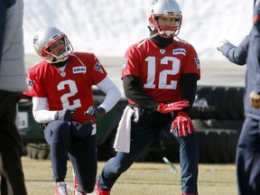 Patriots quarterbacks Tom Brady (12) and Brian Hoyer (2) warm up during a practice, Friday, Jan. 19, 2018, in Foxborough, Mass. The Patriots host the Jaguars in the AFC Championship on Sunday in Foxborough.