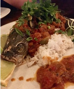 Grilled branzino us roasted to perfection in the wood-fired oven and served tableside at Roost.