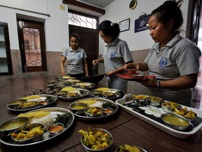 Women with the Sisterhood of Survivors program in Kathmandu, Nepal, teach travellers with G Adventures how to make momos. Supported by the Planeterra Foundation, the program is part of the non-profit SASANE organization, which helps survivors of human trafficking.