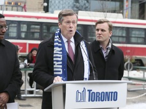 Mayor John Tory  (centre), Councillor Michael Thompson (left) and Councillor Joe Cressy hold a press conference in support of the year-long King Street transit pilot on King St  W. in Toronto on Tuesday January 9, 2018. Veronica Henri/Toronto Sun