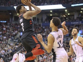 Toronto Raptors guard Kyle Lowry (7)and San Antonio Spurs guard Bryn Forbes (11) in Toronto, Ont. on Friday January 19, 2018.The Toronto Raptors host the San Antonio Spurs at the Air Canada Centre. Veronica Henri/Toronto Sun/Postmedia Network
