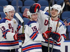 United States teammates celebrate a goal during the bronze medal game of the world junior hockey championships against the Czech Republic on Jan. 5, 2018