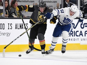 Reilly Smith of the Vegas Golden Knights skates with the puck against Jake Gardiner of the Toronto Maple Leafs on Dec. 31, 2017