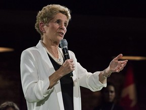 Premier Kathleen Wynne addresses questions from the public during a town hall meeting in Toronto on Monday, November 20, 2017.