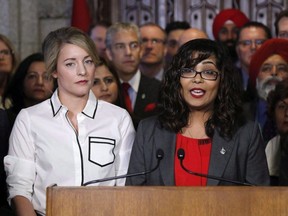 Liberal MP Iqra Khalid makes an announcement about an anti-Islamophobia motion on Parliament Hill while Minister of Canadian Heritage Melanie Joly looks on in Ottawa on Wednesday, February 15, 2017. THE CANADIAN PRESS/ Patrick Doyle