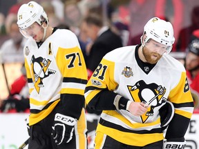 Evgeni Malkin (L) and Phil Kessel have lifted each other into the top five in NHL scoring with torrid scoring lines since the New Year. Wayne Cuddington/Postmedia