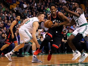 Raptors' DeMar DeRozan drives against the Celtics' Jaylen Brown during a game last season. (GETTY IMAGES)