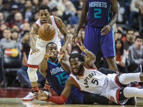 Toronto Raptors' Kyle Lowry (left) will go head-to-head with Charlotte Hornets' Kemba Walker on Sunday afternoon. (ERNEST DOROSZUK/Toronto Sun)