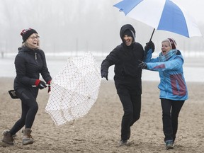 Karlie St. Jean, her husband, Steve, and mom, Karen Hopf, have fun on Monday at  Ashbridges Bay. (CRIAG ROBERTSON, Toronto Sun)