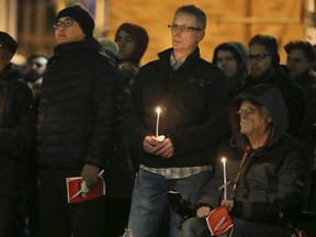 Hundreds gathered for a vigil Tuesday night at  Barbara Hall Park on Church St. (VERONICA HENRI, Toronto Sun)