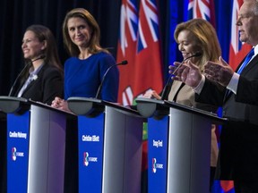 PC leadership candidates (from front to back) Doug Ford, Christine Elliot, Caroline Mulroney and Tanya Granic Allen at Wednesday night's debate. (The Canadian Press)