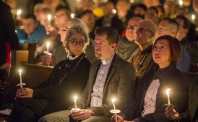 Senior Pastor Rev. Jeff Rock (middle) are pictured earlier this month during a candlelight vigil for the alleged victims of accused serial killer Bruce McArthur, held at the Metropolitan Community Church of Toronto. (Ernest Doroszuk,Toronto Sun)
