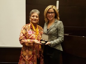 Raheel Raza, left, being awarded a Senate of Canada 150 medal with Senator Linda Frum. on Jan. 29, 2018.