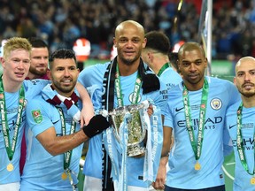 Manchester City celebrates after defeating Arsenal to win the Carabao League Cup.
 (GETTY IMAGES)