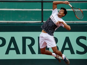 Bolivia's Federico Zeballos returns the ball to Peru during a Davis Cup double tennis match in La Paz, Bolivia, on Feb. 4, 2018