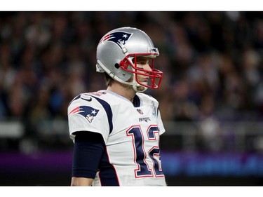 Tom Brady #12 of the New England Patriots looks on against the Philadelphia Eagles during the first quarter in Super Bowl LII at U.S. Bank Stadium on February 4, 2018 in Minneapolis, Minnesota.