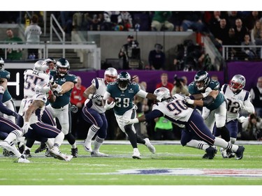 MINNEAPOLIS, MN - FEBRUARY 04: LeGarrette Blount #29 of the Philadelphia Eagles attempts to carries the ball past Malcom Brown #90 of the New England Patriots during the first quarter in Super Bowl LII at U.S. Bank Stadium on February 4, 2018 in Minneapolis, Minnesota.