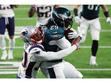 LeGarrette Blount #29 of the Philadelphia Eagles carries the ball defended by Duron Harmon #30 of the New England Patriots in Super Bowl LII at U.S. Bank Stadium on February 4, 2018 in Minneapolis, Minnesota.