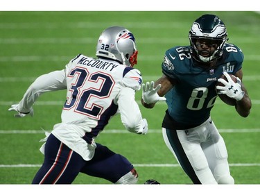 Torrey Smith #82 of the Philadelphia Eagles carries the ball defended by Devin McCourty #32 of the New England Patriots in the third quarter of Super Bowl LII at U.S. Bank Stadium on February 4, 2018 in Minneapolis, Minnesota.
