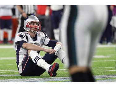 Tom Brady #12 of the New England Patriots reacts after fumbling the ball during the fourth quarter against the Philadelphia Eagles in Super Bowl LII at U.S. Bank Stadium on February 4, 2018 in Minneapolis, Minnesota.  The Philadelphia Eagles defeated the New England Patriots 41-33.