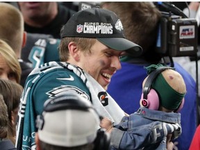 Nick Foles #9 of the Philadelphia Eagles celebrates with his daughter Lily Foles after his 41-33 victory over the New England Patriots in Super Bowl LII at U.S. Bank Stadium on February 4, 2018 in Minneapolis, Minnesota. The Philadelphia Eagles defeated the New England Patriots 41-33.