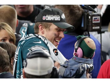 Nick Foles #9 of the Philadelphia Eagles celebrates with his daughter Lily Foles after his 41-33 victory over the New England Patriots in Super Bowl LII at U.S. Bank Stadium on February 4, 2018 in Minneapolis, Minnesota. The Philadelphia Eagles defeated the New England Patriots 41-33.