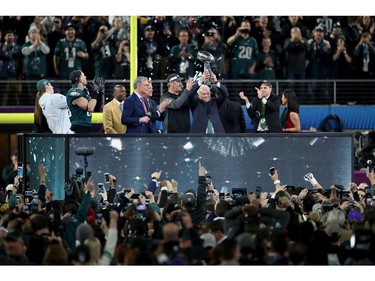 Owner Jeffrey Lurie of the Philadelphia Eagles raises the Vince Lombardi Trophy after defeating the New England Patriots 41-33 in Super Bowl LII at U.S. Bank Stadium on February 4, 2018 in Minneapolis, Minnesota.