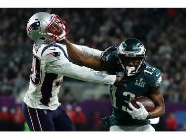 Nelson Agholor #13 of the Philadelphia Eagles stiff arms Duron Harmon #30 of the New England Patriots during the second half in Super Bowl LII at U.S. Bank Stadium on February 4, 2018 in Minneapolis, Minnesota.