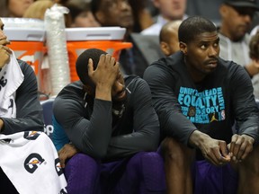 It was a long afternoon for Charlotte teammates Nicolas Batum #5, Kemba Walker #15 and Marvin Williams #2. Getty Images