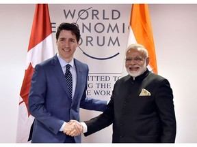 In this photograph released by the Indian Press Information Department on Jan. 23, 2018, Indian Prime Minister Narendra Modi (R) shakes hands with Prime Minister Justin Trudeau at the World Economic Forum in Davos. (HANDOUT/AFP/Getty Images)